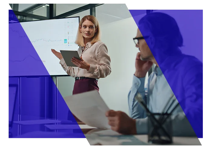 Accounting professional presenting information to colleagues during an office meeting