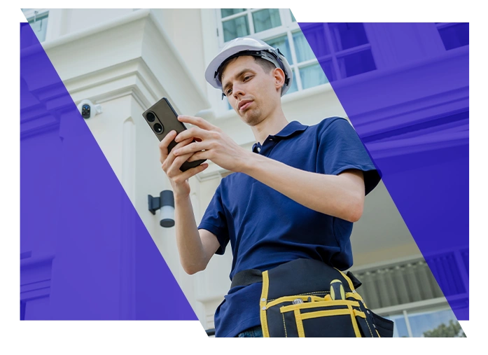 Electrical contractor using a smartphone while working on site