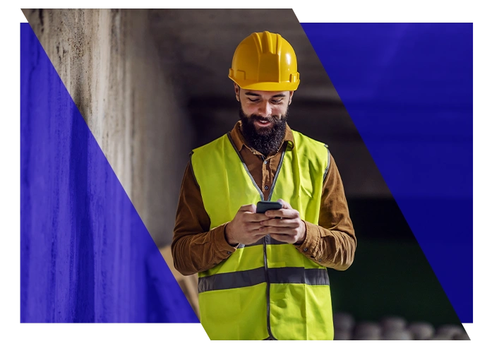 HVAC technician using a smartphone at a job site