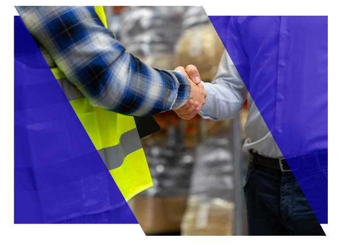 HVAC contractor shaking hands with a business professional