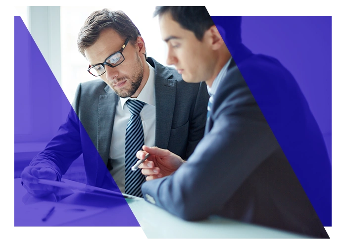 Legal professionals reviewing documents together at a desk