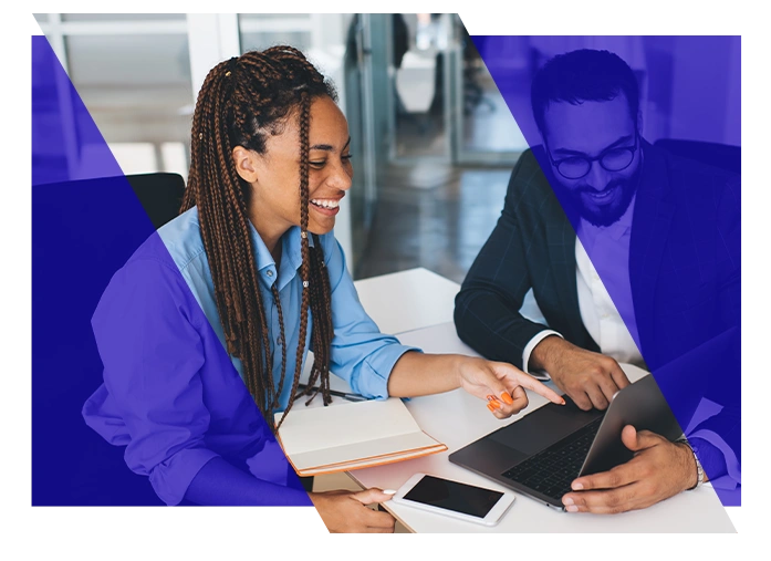 Legal professionals reviewing information together on a laptop