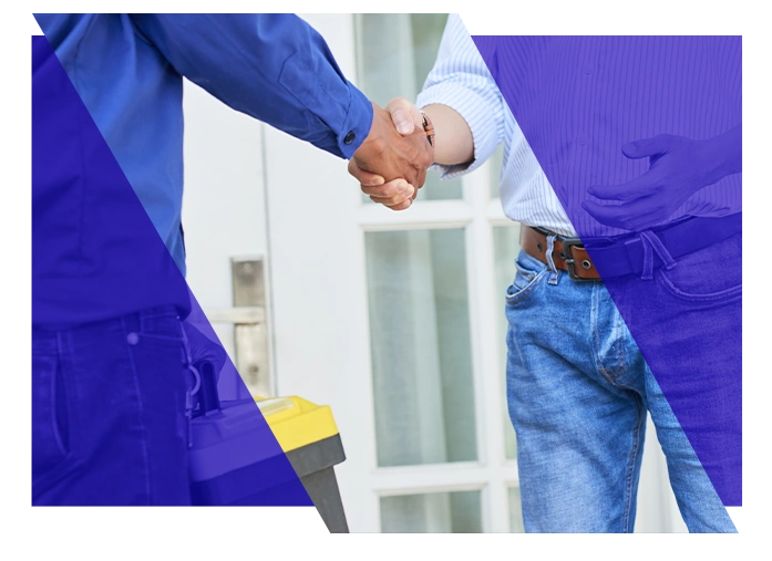 Plumbing contractor shaking hands with a customer