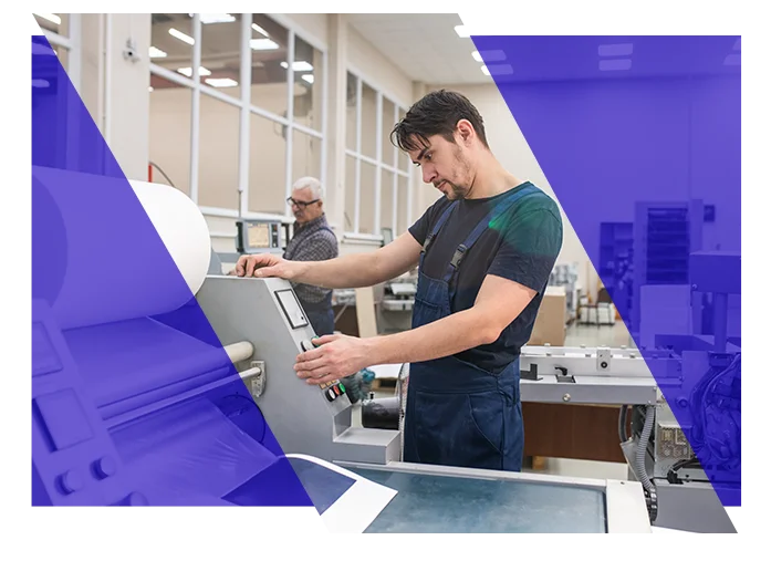 Print production employee operating commercial printing equipment