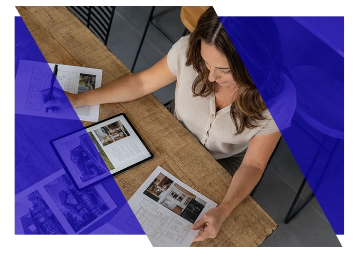 Property management professional reviewing property information at a desk