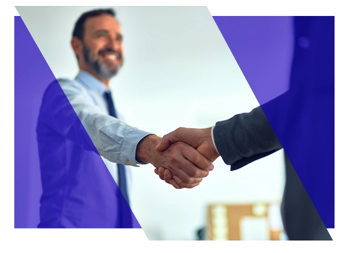 Business professionals shaking hands in an office