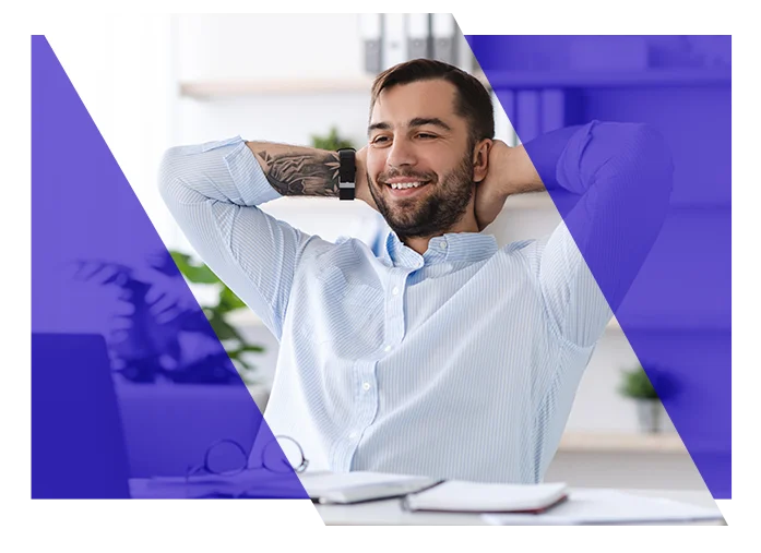 Business professional working comfortably at a laptop in an office