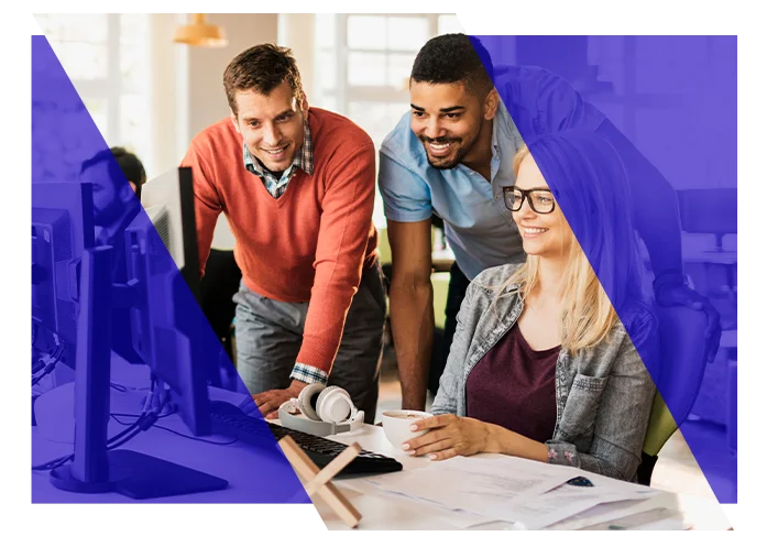 Business team collaborating around a computer in an office